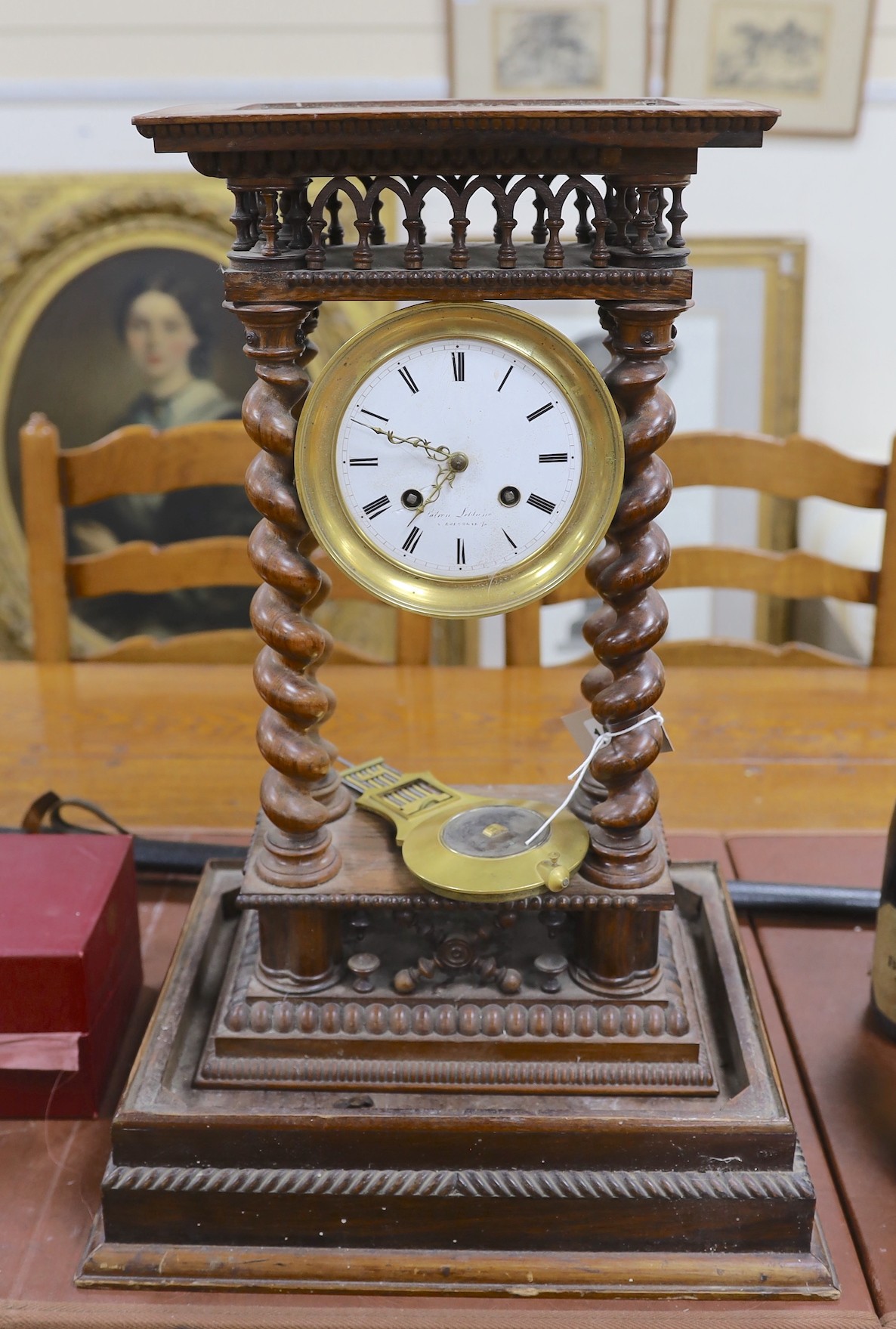 A 19th century French rosewood portico clock and stand, total height 53.5 cm